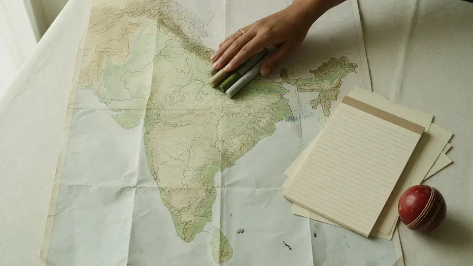 Notebook with state-by-state research notes opened to a new page